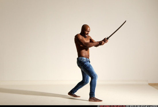 Man Adult Athletic Black Fighting with sword Moving poses Pants