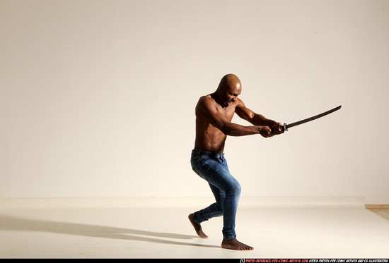 Man Adult Athletic Black Fighting with sword Moving poses Pants