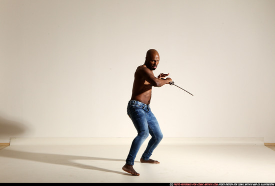 Man Adult Athletic Black Fighting with sword Moving poses Pants