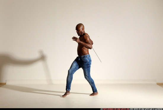 Man Adult Athletic Black Fighting with sword Moving poses Pants