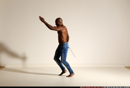 Man Adult Athletic Black Fighting with sword Moving poses Pants