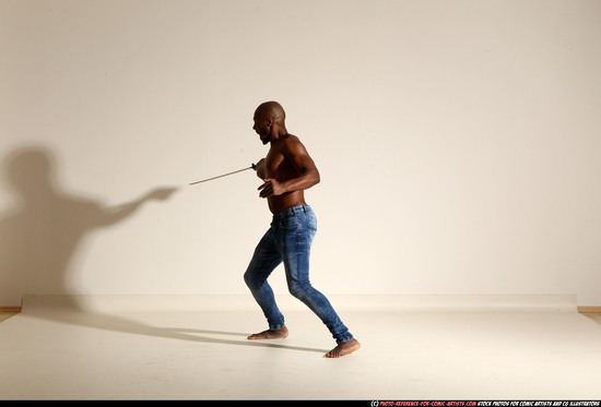 Man Adult Athletic Black Fighting with sword Moving poses Pants