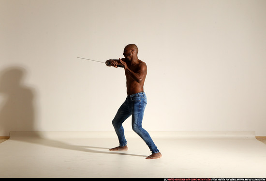 Man Adult Athletic Black Fighting with sword Moving poses Pants