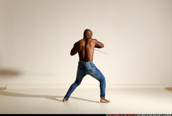 Man Adult Athletic Black Fighting with sword Moving poses Pants