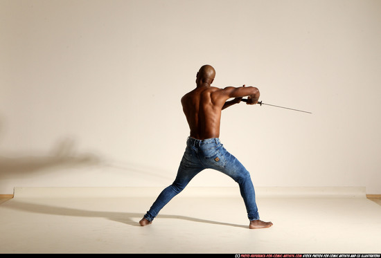 Man Adult Athletic Black Fighting with sword Moving poses Pants