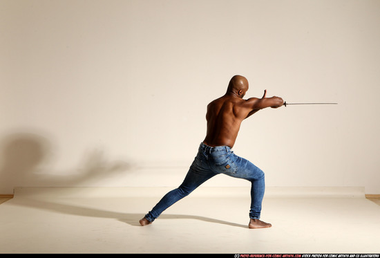 Man Adult Athletic Black Fighting with sword Moving poses Pants