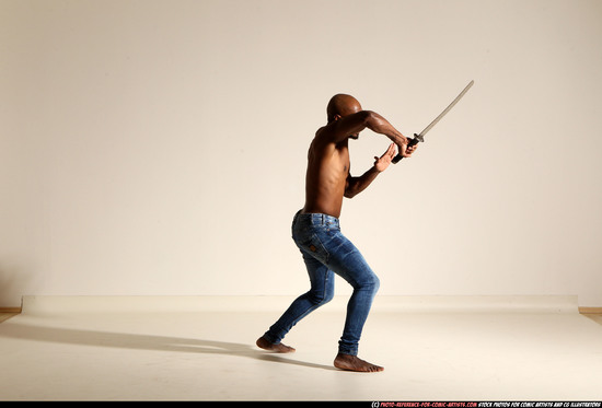 Man Adult Athletic Black Fighting with sword Moving poses Pants