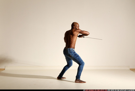 Man Adult Athletic Black Fighting with sword Moving poses Pants