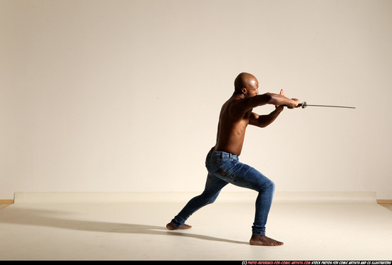 Man Adult Athletic Black Fighting with sword Moving poses Pants