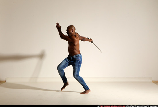 Man Adult Athletic Black Fighting with sword Moving poses Pants