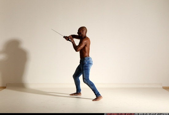 Man Adult Athletic Black Fighting with sword Moving poses Pants