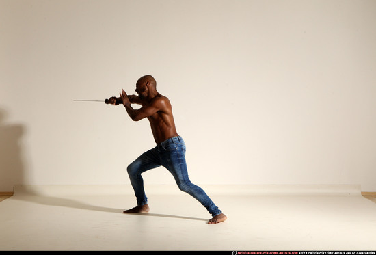 Man Adult Athletic Black Fighting with sword Moving poses Pants