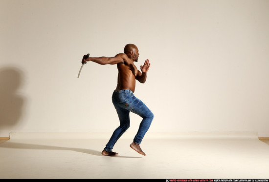 Man Adult Athletic Black Fighting with sword Moving poses Pants