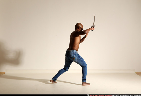 Man Adult Athletic Black Fighting with sword Moving poses Pants