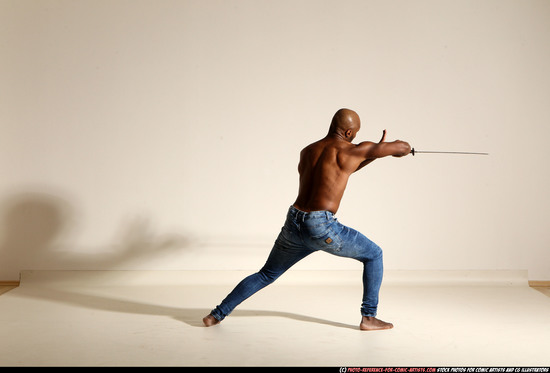 Man Adult Athletic Black Fighting with sword Moving poses Pants