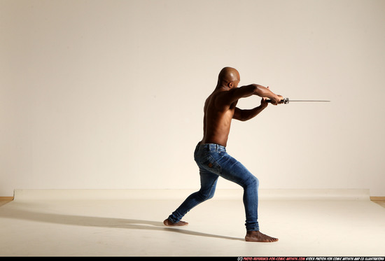 Man Adult Athletic Black Fighting with sword Moving poses Pants