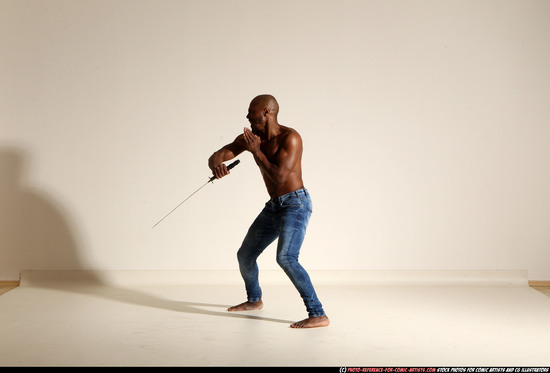 Man Adult Athletic Black Fighting with sword Moving poses Pants