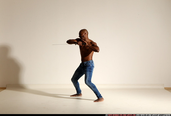 Man Adult Athletic Black Fighting with sword Moving poses Pants