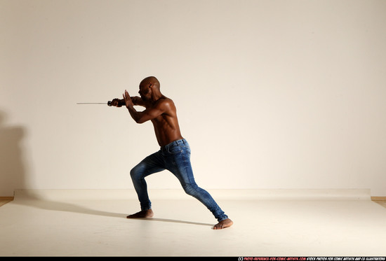 Man Adult Athletic Black Fighting with sword Moving poses Pants