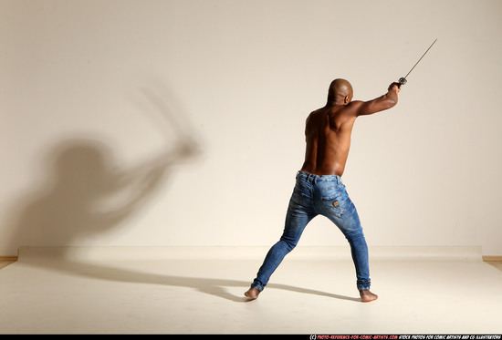 Man Adult Athletic Black Fighting with sword Moving poses Pants