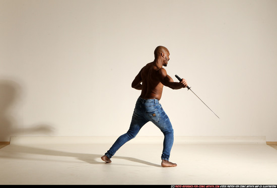 Man Adult Athletic Black Fighting with sword Moving poses Pants