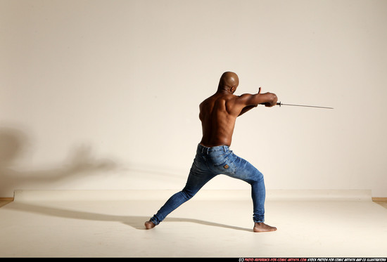 Man Adult Athletic Black Fighting with sword Moving poses Pants