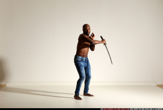 Man Adult Athletic Black Fighting with sword Moving poses Pants