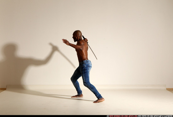 Man Adult Athletic Black Fighting with sword Moving poses Pants