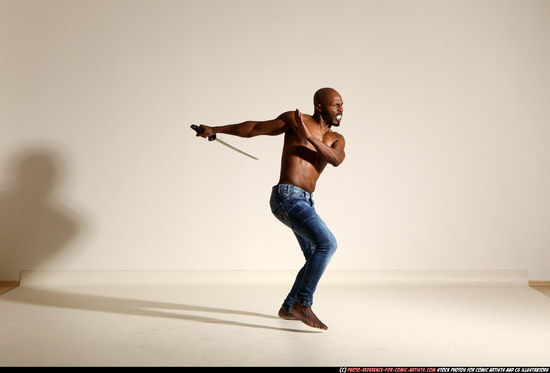 Man Adult Athletic Black Fighting with sword Moving poses Pants