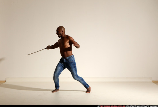 Man Adult Athletic Black Fighting with sword Moving poses Pants