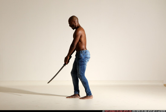 Man Adult Athletic Black Fighting with sword Moving poses Pants