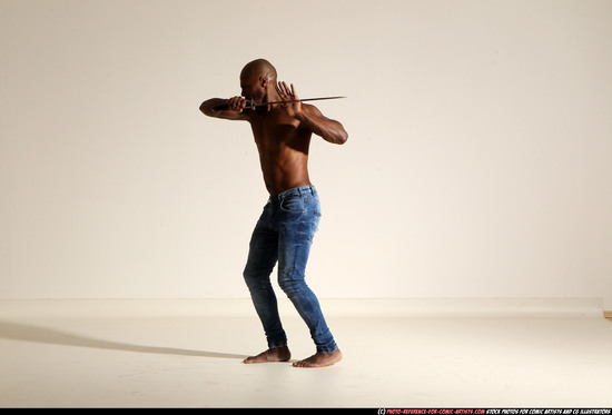 Man Adult Athletic Black Fighting with sword Moving poses Pants