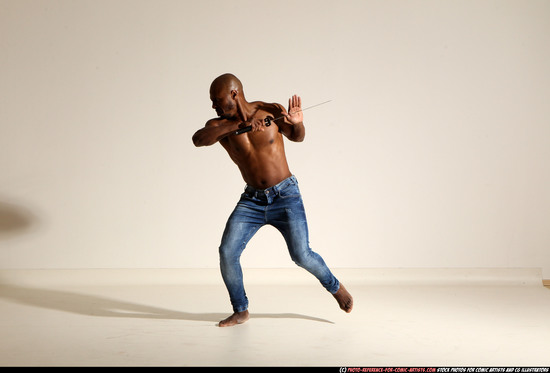 Man Adult Athletic Black Fighting with sword Moving poses Pants