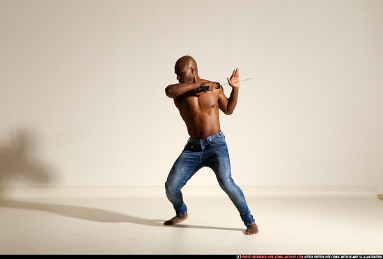 Man Adult Athletic Black Fighting with sword Moving poses Pants