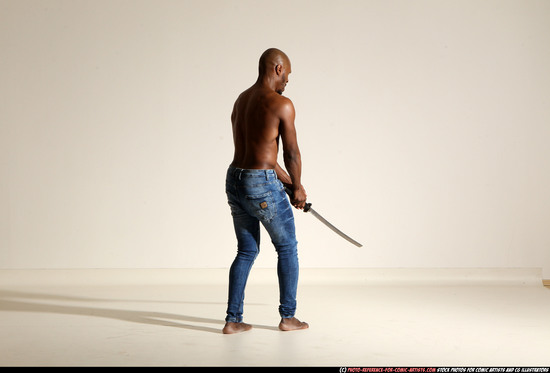 Man Adult Athletic Black Fighting with sword Moving poses Pants