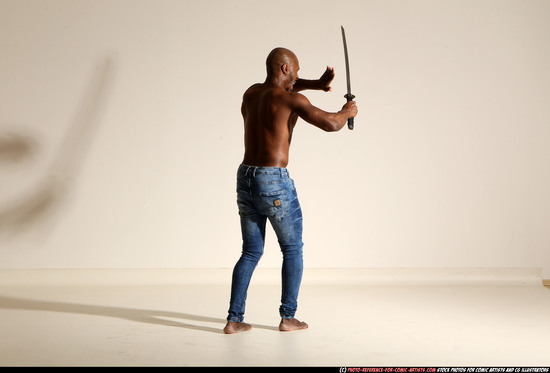 Man Adult Athletic Black Fighting with sword Moving poses Pants