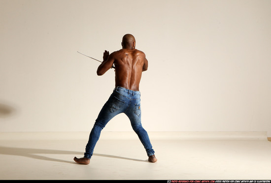 Man Adult Athletic Black Fighting with sword Moving poses Pants