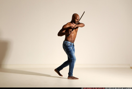 Man Adult Athletic Black Fighting with sword Moving poses Pants