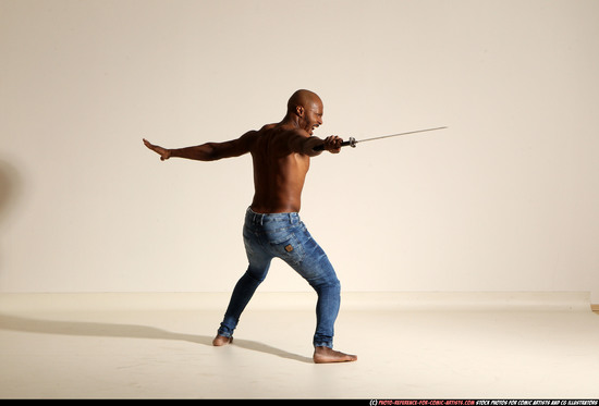 Man Adult Athletic Black Fighting with sword Moving poses Pants