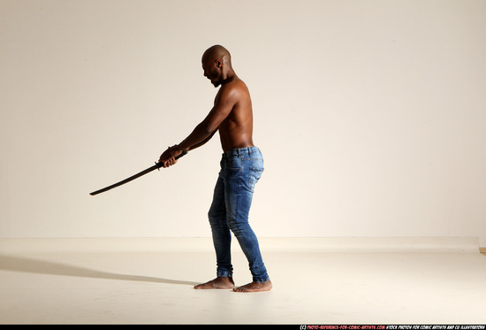 Man Adult Athletic Black Fighting with sword Moving poses Pants