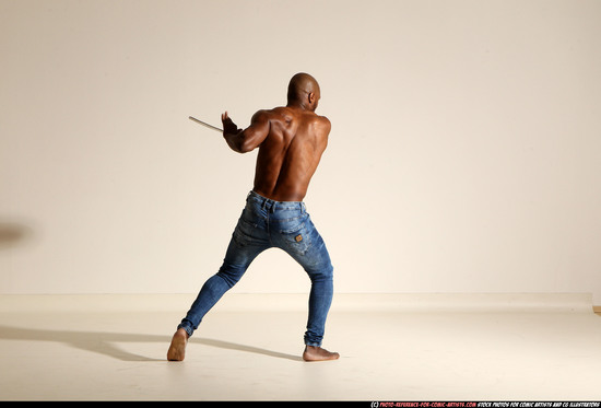 Man Adult Athletic Black Fighting with sword Moving poses Pants