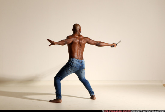 Man Adult Athletic Black Fighting with sword Moving poses Pants