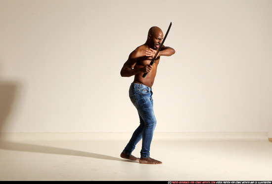 Man Adult Athletic Black Fighting with sword Moving poses Pants