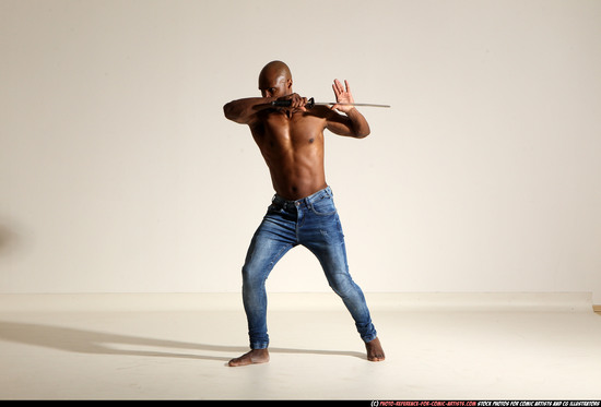 Man Adult Athletic Black Fighting with sword Moving poses Pants