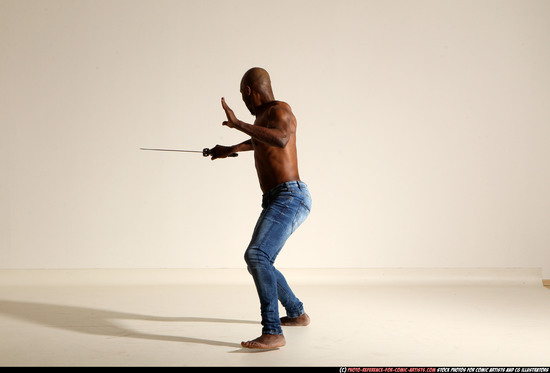 Man Adult Athletic Black Fighting with sword Moving poses Pants