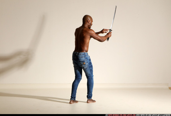 Man Adult Athletic Black Fighting with sword Moving poses Pants