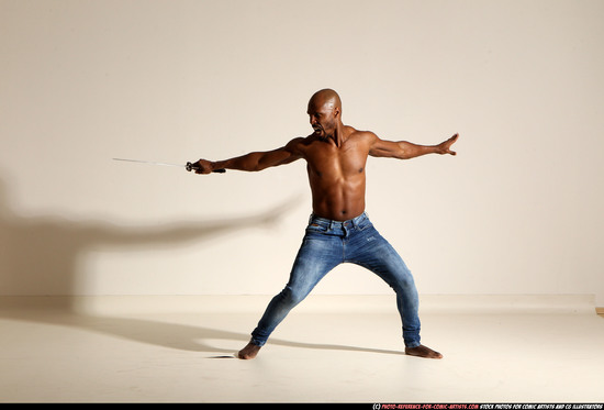 Man Adult Athletic Black Fighting with sword Moving poses Pants