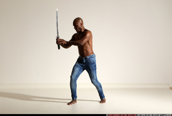 Man Adult Athletic Black Fighting with sword Moving poses Pants