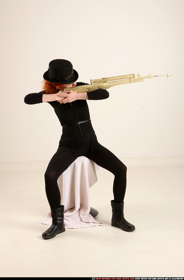 Woman Adult Athletic White Fighting with gun Sitting poses Casual