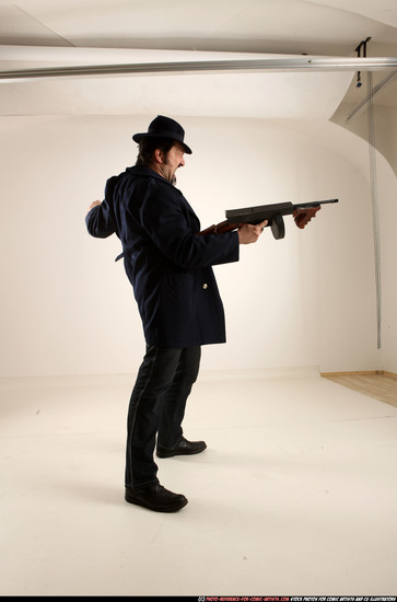 Man Old Average White Fighting with gun Standing poses Coat